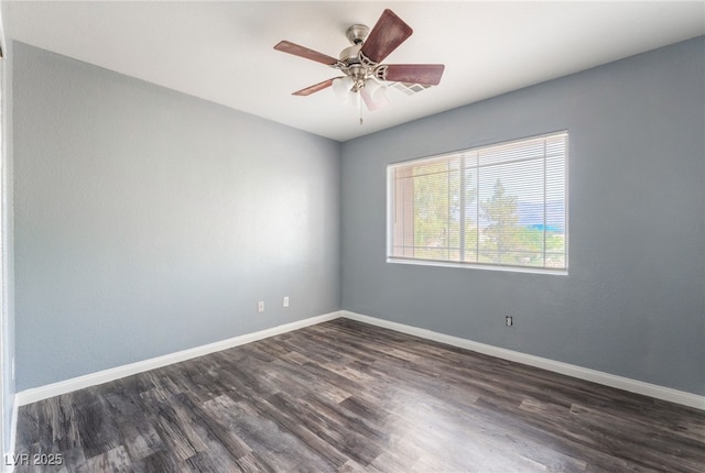 28 Yellow Flame Ave, North Las Vegas, NV 89084 - unfurnished room with dark wood-type flooring, baseboards, and a ceiling fan