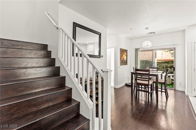 9613 Eland Ct, Las Vegas, NV 89149 - stairs featuring wood finished floors and baseboards