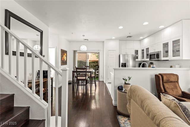 9613 Eland Ct, Las Vegas, NV 89149 - living area featuring dark wood-style floors, stairway, and recessed lighting