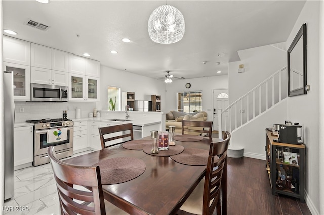 9613 Eland Ct, Las Vegas, NV 89149 - dining space with stairway, a ceiling fan, recessed lighting, and baseboards