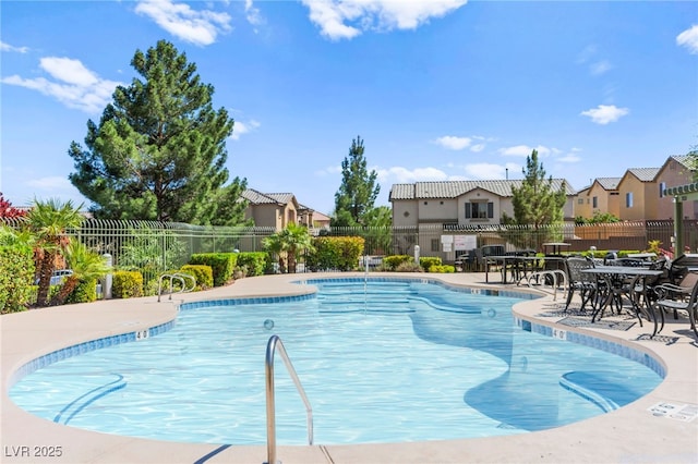 9613 Eland Ct, Las Vegas, NV 89149 - community pool with a residential view and a patio area