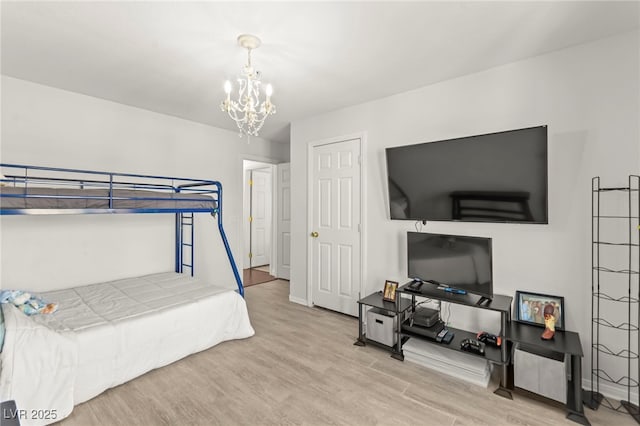 9613 Eland Ct, Las Vegas, NV 89149 - bedroom with a chandelier, wood finished floors, and baseboards