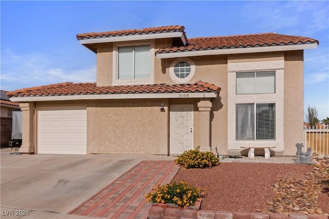 3008 Soledad Dr, Laughlin, NV 89029 - mediterranean / spanish-style house with a tiled roof, stucco siding, and driveway