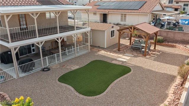 3008 Soledad Dr, Laughlin, NV 89029 - rear view of property featuring a patio area, a gazebo, a tile roof, stucco siding, and a fenced backyard