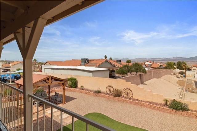 3008 Soledad Dr, Laughlin, NV 89029 - fenced backyard featuring a gazebo, a residential view, central AC, a patio area, and a mountain view