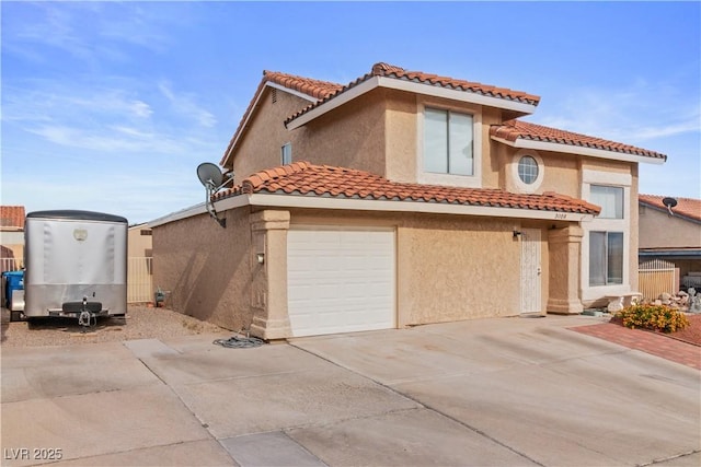 3008 Soledad Dr, Laughlin, NV 89029 - mediterranean / spanish-style house featuring stucco siding, a tiled roof, driveway, and a garage