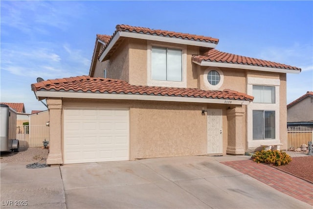 3008 Soledad Dr, Laughlin, NV 89029 - mediterranean / spanish-style home with a tiled roof, driveway, and stucco siding