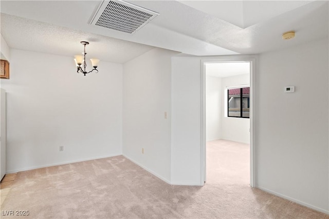 3740 Desert Marina Dr Unit 2, Laughlin, NV 89029 - spare room featuring light colored carpet, a chandelier, a smoke detector, a textured ceiling, and baseboards