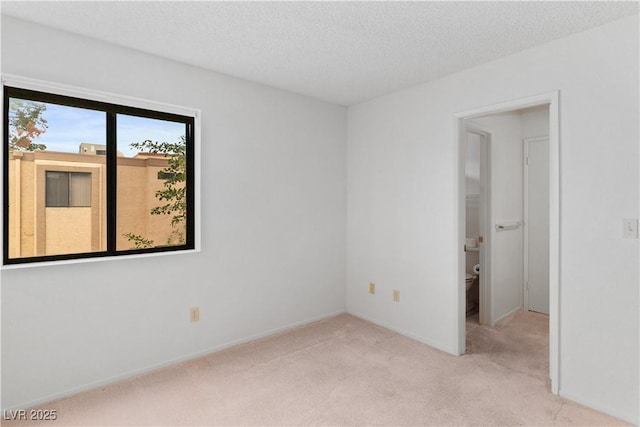 3740 Desert Marina Dr Unit 2, Laughlin, NV 89029 - carpeted empty room with a textured ceiling