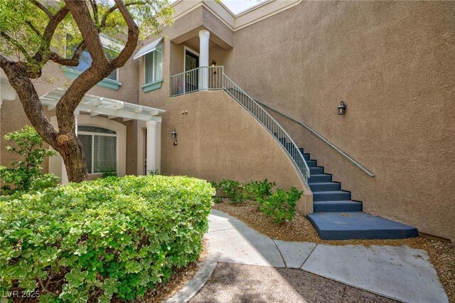 9112 Vista Greens Way Unit 204, Las Vegas, NV 89134 - entrance to property with stucco siding and a pergola