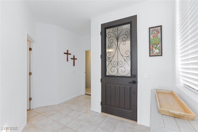 9112 Vista Greens Way Unit 204, Las Vegas, NV 89134 - foyer with baseboards and light tile patterned floors
