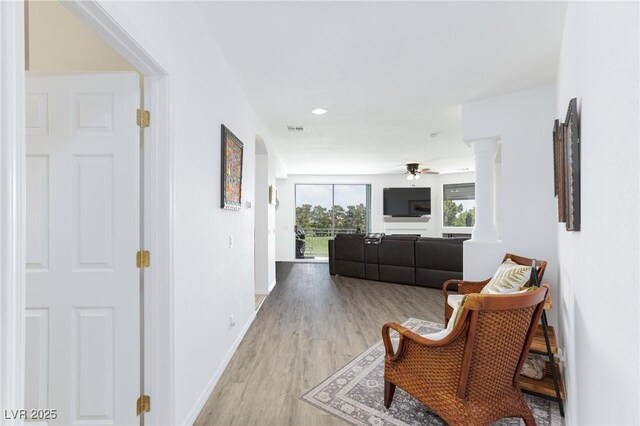 9112 Vista Greens Way Unit 204, Las Vegas, NV 89134 - hall featuring light wood-style flooring, ornate columns, baseboards, and recessed lighting