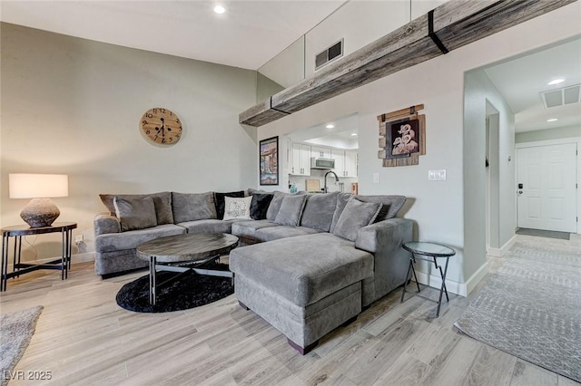 450 Intrepid Ct, Boulder City, NV 89005 - living room with light wood-style floors, baseboards, recessed lighting, and high vaulted ceiling