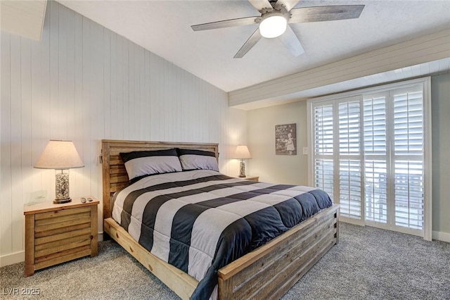 450 Intrepid Ct, Boulder City, NV 89005 - bedroom featuring carpet floors, access to exterior, a ceiling fan, and wooden walls