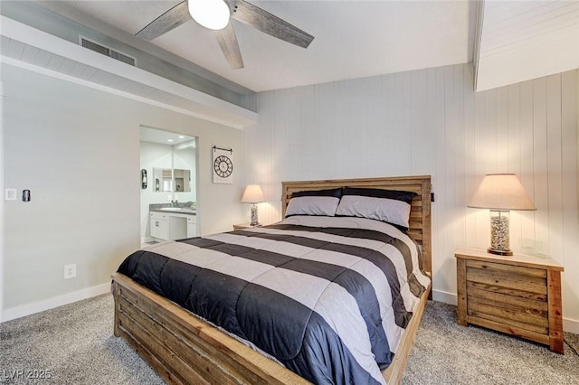 450 Intrepid Ct, Boulder City, NV 89005 - bedroom featuring carpet floors, connected bathroom, ceiling fan, and a sink