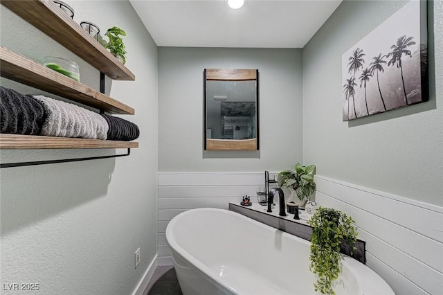 450 Intrepid Ct, Boulder City, NV 89005 - bathroom featuring a soaking tub and wainscoting
