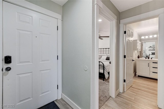 450 Intrepid Ct, Boulder City, NV 89005 - entrance foyer with light wood-style flooring, a ceiling fan, and baseboards