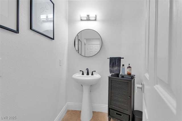 4108 Royal Scots Ave, Las Vegas, NV 89141 - half bath with toilet, tile patterned flooring, baseboards, and a sink