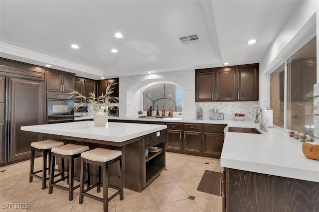 4108 Royal Scots Ave, Las Vegas, NV 89141 - kitchen featuring a sink, tasteful backsplash, dark brown cabinets, and recessed lighting
