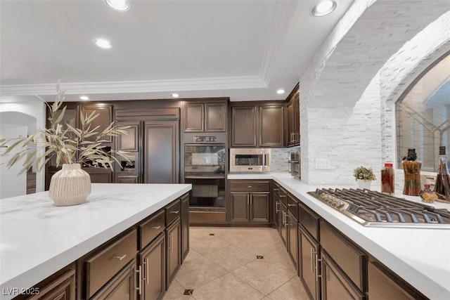 4108 Royal Scots Ave, Las Vegas, NV 89141 - kitchen with appliances with stainless steel finishes, light countertops, recessed lighting, decorative backsplash, and ornamental molding