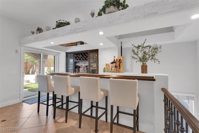 4108 Royal Scots Ave, Las Vegas, NV 89141 - indoor dry bar featuring a tray ceiling, tile patterned floors, baseboards, and recessed lighting