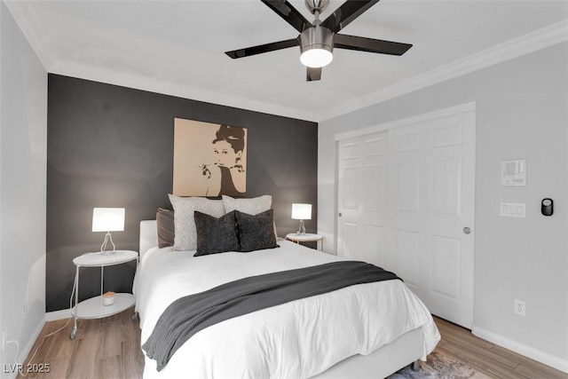 4108 Royal Scots Ave, Las Vegas, NV 89141 - bedroom with ornamental molding, baseboards, a closet, wood finished floors, and ceiling fan