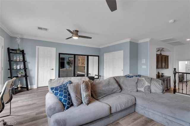 4108 Royal Scots Ave, Las Vegas, NV 89141 - living room featuring a ceiling fan, light wood-type flooring, crown molding, and baseboards