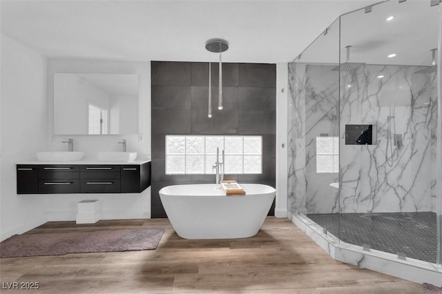 4108 Royal Scots Ave, Las Vegas, NV 89141 - full bathroom with a marble finish shower, double vanity, a freestanding bath, wood finished floors, and recessed lighting
