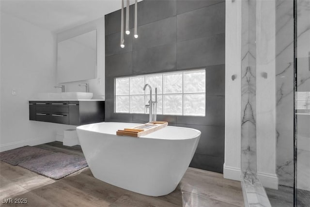 4108 Royal Scots Ave, Las Vegas, NV 89141 - full bathroom with vanity, a soaking tub, wood finished floors, and a marble finish shower