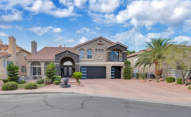 4108 Royal Scots Ave, Las Vegas, NV 89141 - mediterranean / spanish house featuring stucco siding, concrete driveway, an attached garage, a tile roof, and central air condition unit