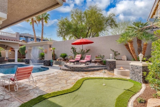 4108 Royal Scots Ave, Las Vegas, NV 89141 - view of patio with a putting area and an outdoor fire pit