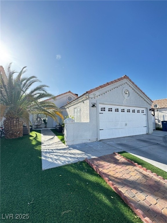 1505 Lilac Breeze Cir, Las Vegas, NV 89108 - view of front of home with concrete driveway, a garage, and stucco siding