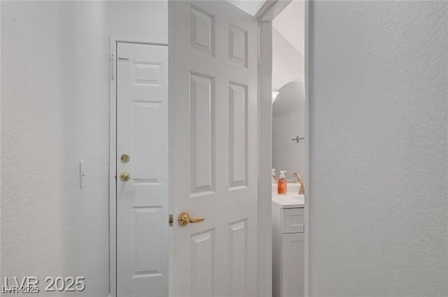 6320 Desert Leaf St Unit 101, North Las Vegas, NV 89081 - corridor with a textured wall