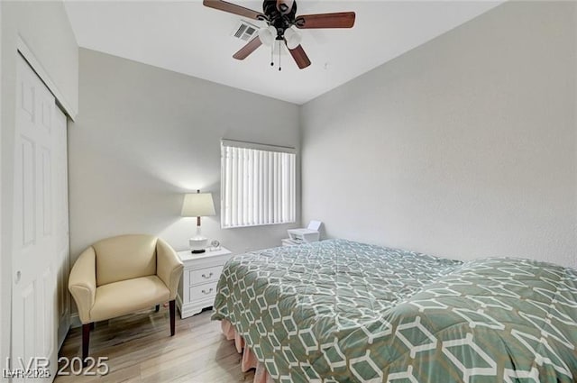 6320 Desert Leaf St Unit 101, North Las Vegas, NV 89081 - bedroom featuring wood finished floors, a closet, and a ceiling fan