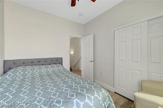 6320 Desert Leaf St Unit 101, North Las Vegas, NV 89081 - bedroom with wood finished floors, baseboards, a ceiling fan, and a closet