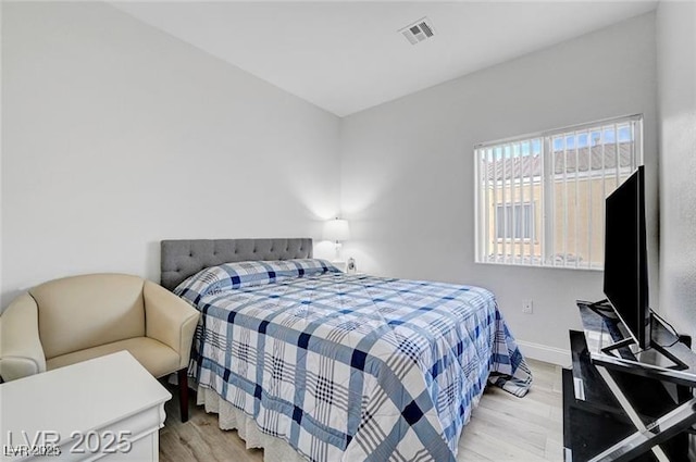 6320 Desert Leaf St Unit 101, North Las Vegas, NV 89081 - bedroom featuring light wood-style flooring and baseboards