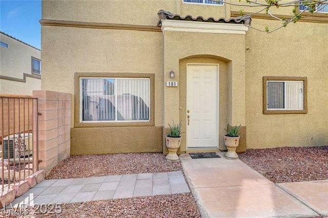 6320 Desert Leaf St Unit 101, North Las Vegas, NV 89081 - property entrance with stucco siding and a gate