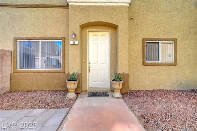 6320 Desert Leaf St Unit 101, North Las Vegas, NV 89081 - entrance to property with stucco siding