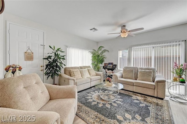 6320 Desert Leaf St Unit 101, North Las Vegas, NV 89081 - living area featuring wood finished floors and a ceiling fan