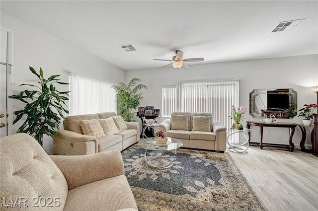 6320 Desert Leaf St Unit 101, North Las Vegas, NV 89081 - living area with plenty of natural light, ceiling fan, and wood finished floors