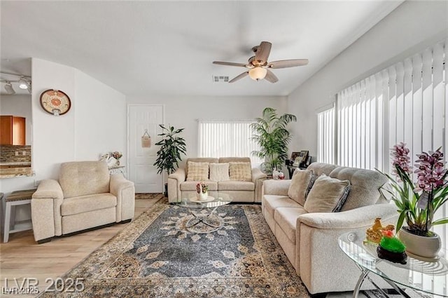 6320 Desert Leaf St Unit 101, North Las Vegas, NV 89081 - living area with light wood finished floors and ceiling fan