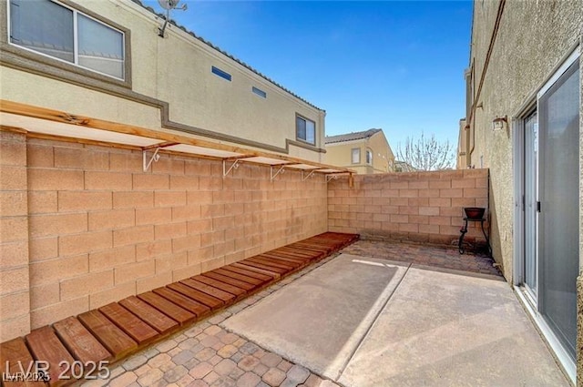 6320 Desert Leaf St Unit 101, North Las Vegas, NV 89081 - fenced backyard with a patio