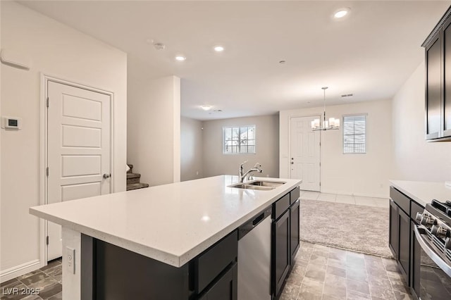 762 Star Estates Ave Unit 0, North Las Vegas, NV 89086 - kitchen featuring appliances with stainless steel finishes, a sink, light countertops, a chandelier, and a center island with sink