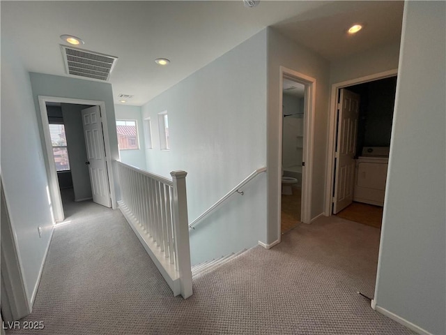 4749 Golden Shimmer Ave, Las Vegas, NV 89139 - hallway with an upstairs landing, washer / clothes dryer, carpet flooring, baseboards, and recessed lighting
