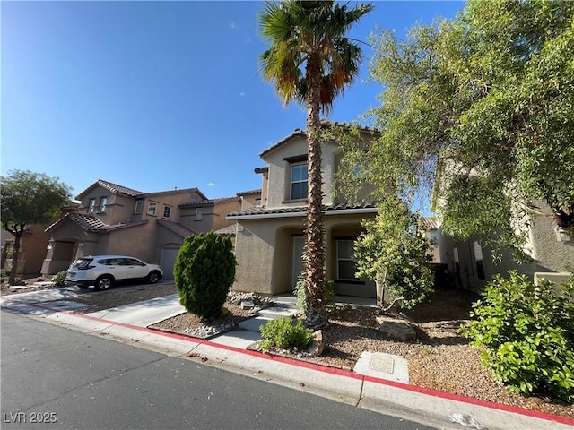 4749 Golden Shimmer Ave, Las Vegas, NV 89139 - mediterranean / spanish-style house with stucco siding, a tile roof, and driveway