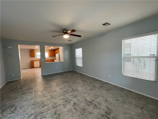 4749 Golden Shimmer Ave, Las Vegas, NV 89139 - unfurnished living room featuring a ceiling fan and baseboards