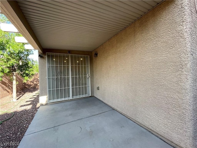 4749 Golden Shimmer Ave, Las Vegas, NV 89139 - view of exterior entry with stucco siding and a patio area