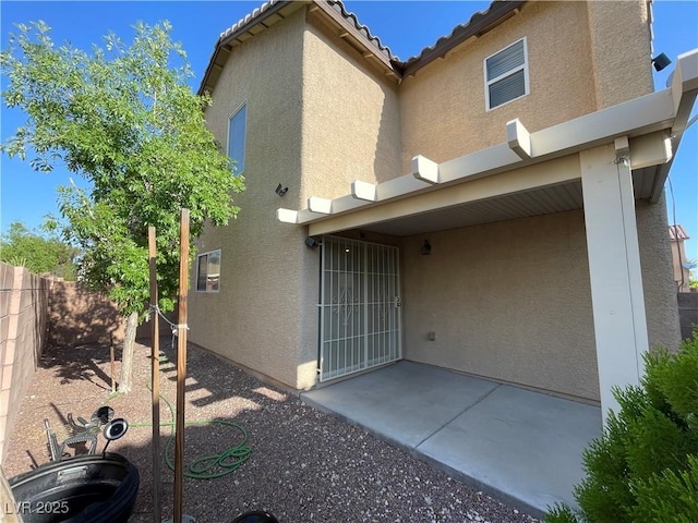 4749 Golden Shimmer Ave, Las Vegas, NV 89139 - back of property with stucco siding and a patio area
