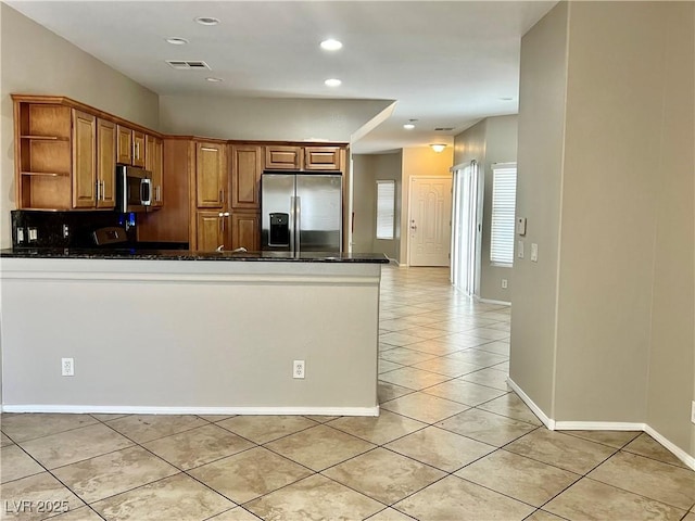 5524 Markley Ave, Las Vegas, NV 89141 - kitchen with appliances with stainless steel finishes, open shelves, a peninsula, light tile patterned floors, and brown cabinets