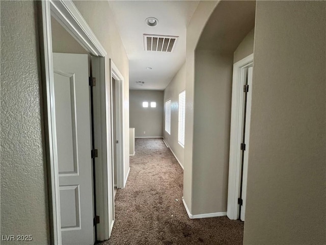 5524 Markley Ave, Las Vegas, NV 89141 - hall with carpet floors, baseboards, and arched walkways